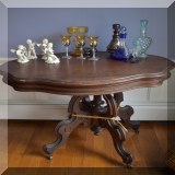 F39. Eastlake oval table with wavy edge. Base being held together with twine. 28”h x 36”w x 27”d - $95 